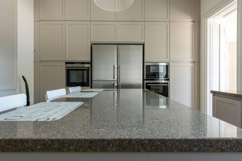 This is image about well furnishd luxuary granite slab kitchen